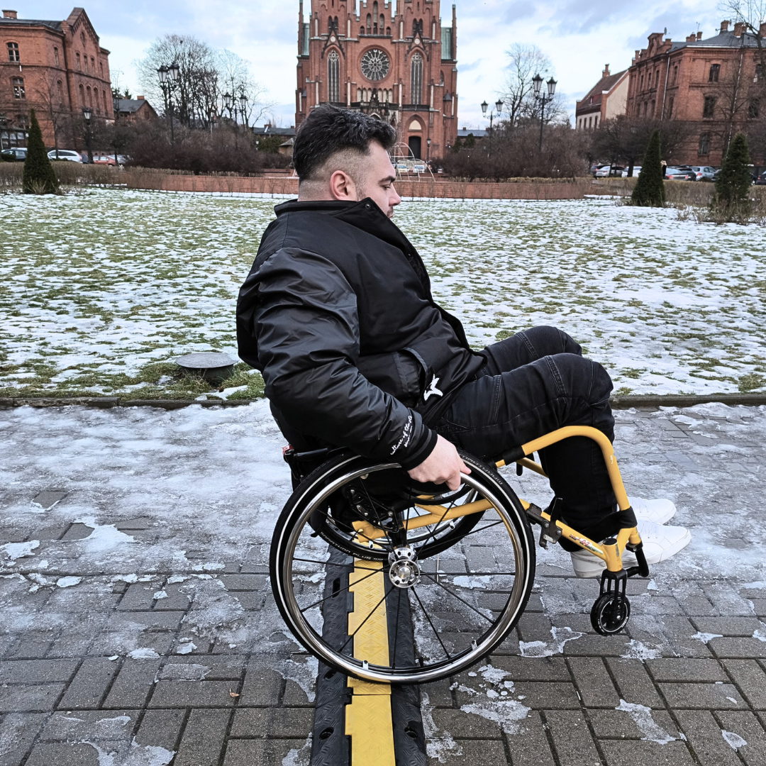 Omobic Tensio Ray fiber spoke wheelchair wheel - wheelchair user during field testing